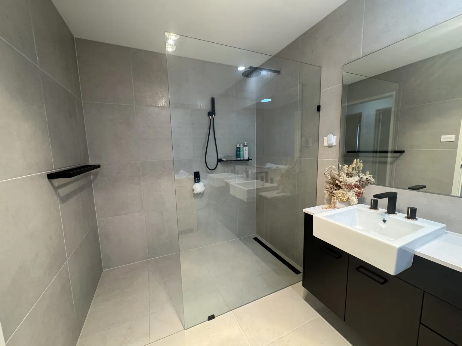 Clean shower glass, tiles and bathroom vanity after a Marry a Mop clean